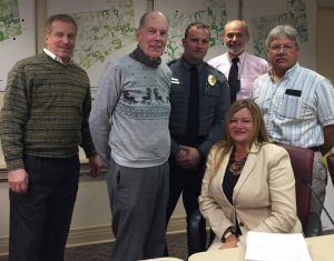 Kennett Township Supervisor Richard L. Leff joins outgoing Supervisor Bob Hammaker, Police Chief Lydell Nolt, Supervisors' Chairman Scudder G. Stevens, Roadmaster Roger Lysle and Township Manager Lisa M. Moore to celebrate Hammaker's tenure with the township.