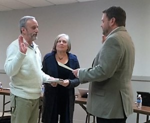 With his wife, Sally Braffman, holding the Bible, Borough Councilman Wayne Braffman (left) is sworn in by Kennett Square Mayor Matt Fetick.
