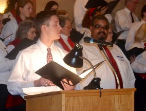 Trevor Seidel (left), a Unionville High senior, is joined at the podium by Chris Jones, a 1996 Kennett High graduate and area musician, for their 'Glory' solos.