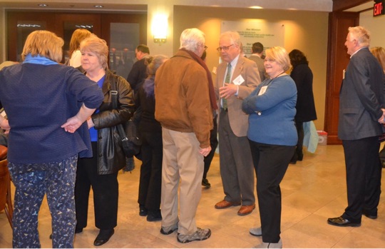 The audience socializes before the formal program for the annual meeting of Historic Kennett Square, held on Thursday, Jan. 28, in the Genesis building.