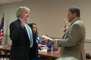 Kennett Square Borough Mayor Matt Fetick (right) administers the oath of office to Councilman Jamie Mallon.