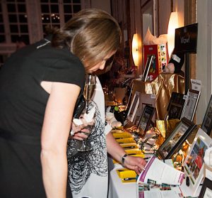 People check out the items included in the Unionville-Chadds Ford Education Foundation silent auction fundraiser Saturday night.
