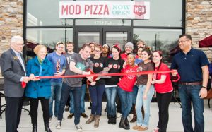 MOD Pizza General Manager Richard Ciszak cuts the ribbon to officially open the pizza shop along Route 202.