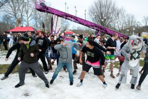 Members of Kappa Sigma get into the swing of things before getting into the swim of things at the Polar Plunge.