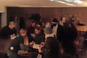 Guests are greeted at the door of the Barns-Brinton House for the debut of 'Tavern Talks.'