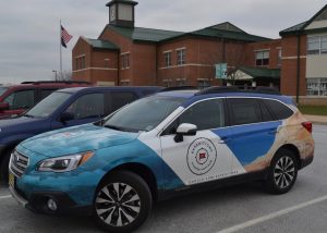 A colorful Google vehicle is used to transport the Expeditions Pioneer Program from school to school.