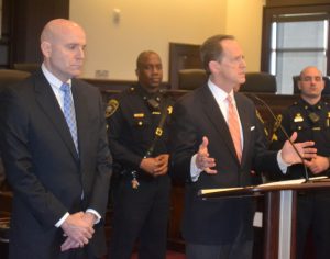 After being introduced by Chester County District Attorney Tom Hogan (left), Sen. Pat Toomey (right) extends thanks to those in law enforcement who put their lives on the line each day. 