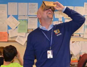 Unionville-Chadds Ford School Superintendent John Sanville directs his gaze skyward during a preview of the Google Expeditions Pioneer Program. 