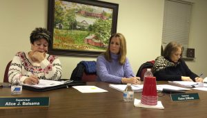 Pocopson Township Supervisors Alice Balsama (from left), Elaine DiMonte, and Ricki Stumpo sign bills at the conclusion of the Monday, Feb. 8, meeting.
