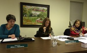 Pocopson Township Supervisors Alice Balsama (from left), Elaine DiMonte and Ricki Stumpo review documents during Monday night's meetings.