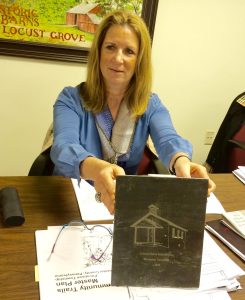 Pocopson Township Supervisor Elaine DiMonte displays one of the larger pieces of engraved slate from the Locust Grove Schoolhouse project.