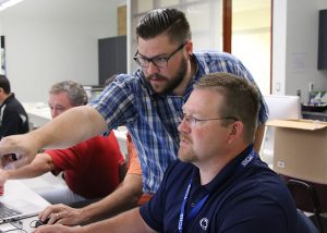 Technical College High School teachers participate in a training session led by Siemens to learn how to use the Solid Edge software. 