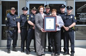 Members of the Westtown-East Goshen Regional Police Department display their accreditation certificate.
