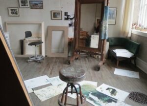 A somewhat unkempt studio contrasts with the precision that Andrew Wyeth achieved in his paintings.