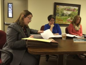 Pocopson Township Supervisors Elaine DiMonte (from right) and Alice Balsama listen as Amanda Sundquist, the township's solicitor, reads the conditions imposed on the proposed daycare center in the Riverside at Chadds Ford subdivision.