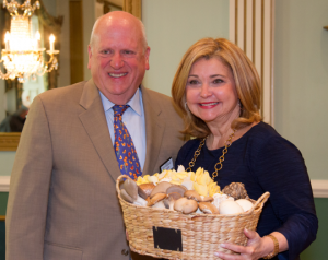 Pat Ciarrocchi., who grew up in mushroom country, gets a basket of mushrooms during a Southern Chester County Chamber of Commerce breakfast. (Photo Credit: Pam Hesler)