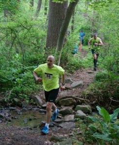 Runners during the 215 race enjoy a stream crossing and beautiful views during the 'Race for Conservation.'