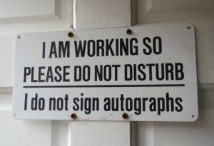 A sign on the door of Andrew Wyeth's studio strives to discourage interruptions.