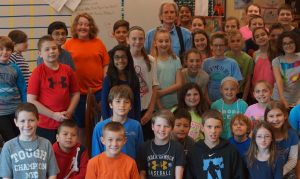 Some of the fifth-graders at Pocopson Elementary pose with author and storyteller Robin Moore, who visited the school on Tuesday, May 10.
