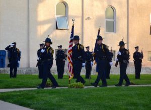 The Chester County Sheriff's Department's Honor Guard retires the colors at the end of the memorial service.