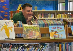 John xx, the children's librarian at the Kennett Public Library, watches an enthralled group of preschoolers during a presentation by author Margie Palatini. 