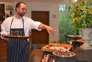 Chef MacGregor Mann, whose catering company will add culinary art to the Brandywine River Museum, directs his staff in the placement of appetizers.