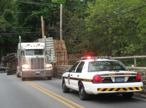 State police from the Avondale barracks monitor the closure of the Lenape Road Bridge on Wednesday, May 18, after a truck overturned a load of pallets.