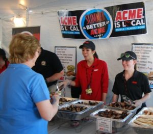 Acme employees have fun serving appreciative attendees at Twisted Vintner.