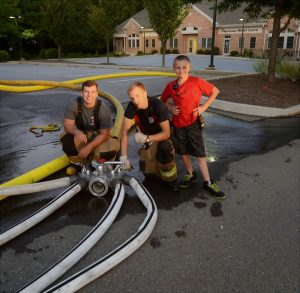 Tyler Bowman (from left), Austin Robuck and Kyle Thompson are shown during a Longwood Fire Company function.