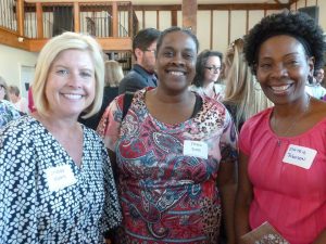 Lindsay Myers (from left) and Chaya Scott of the Coatesville Youth Initiative pose with Matrie Johnson from Home of the Sparrow.