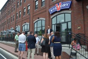 Officials gather at Victory at Magnolia in Kennett Square to admire the West Cypress Street improvements.
