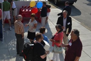 The crowd mingles following the ribbon-cutting for the KACS Resource Center at 138 W. Cedar St.