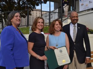 KACS Executive Director Melanie Weiler accepts a proclamation from the Chester County Commissioners: Kathi Cozzone (from left), Michelle Kichline, and Terence Farrell.