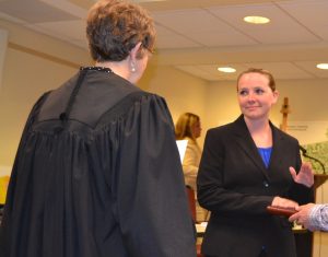 With her husband holding the Bible, Brandi P. McCoy takes the oath from Senior Magisterial District Judge Gwenn S. Knapp, becoming the newest member of the Kennett Township Police Department.