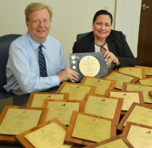 Chester County COO Mark Rupsis (left), shows off the county's plethora of budget awards with Julie Bookheimer, Chester County's finance director. 