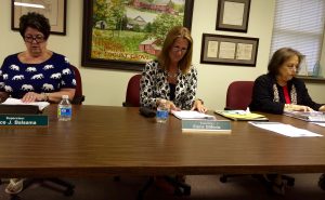 Pocopson Township Supervisors Alice Balsama (from left) and Elaine DiMonte listen as Supervisors' Chairman Ricki Stumpo reads a letter from a resident applauding the Public Works Department.