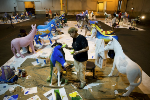 The 'Donkeys Around Town' installation features 57 fiberglass donkeys, representing the 50 states, five U.S. territories, Washington, D.C., and Democrats Abroad. 