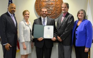 Douglas J. Dunne holds his citation. He is joined by Chester County Commissioners Terence Farrell (from left), Michelle Kichline and Kathi Cozzone (right) and Vincent Brown, 