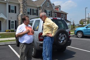 Ethan Cramer (left), a board member of the Carter CDC, discusses the event with Kennett Township Supervisors' Chairman Scudder G. Stevens.