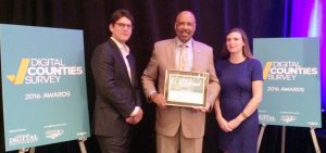 Chester County Commissioners’ Chair Terence Farrell (center) receives the Digital Counties Survey award from Tim Woodbury, director of government relations for Accela and Katie Burke, government program specialist for Laserfiche. 