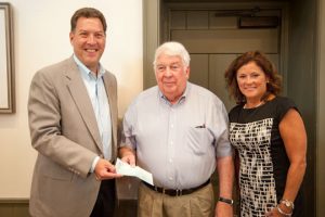 Former Chadds Ford Township Supervisor George Thorpe,  flanked by current supervisors Frank Murphy and Samantha Reiner, receives a $10,000 check for the Brandywine Battlefield Park Associates. Thorpe said the associates would use the money to buy audio/visual equipment for the park.