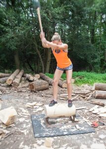 Martha King's axe blade is a blur as she powers through a swing.