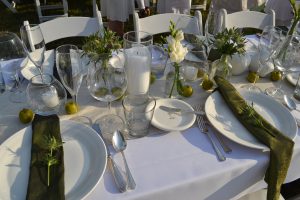 First-time attendee Mindy Rhodes displays her elegant, apple-themed table settings.