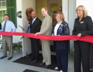 Scott Miller of Miller Designworks, Chester County Commissioners' Chairman Terence Farrell, state Rep. Duane Milne, and CCCVB's Jan Reeps and Susan Hamly participate in the ribbon-cutting.