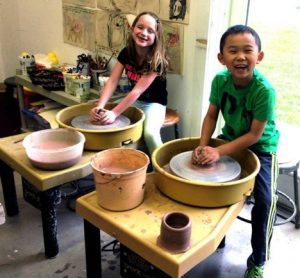 Students Sarah Mowchocki, of Thornton, and Derrick Wang, of Garnet Valley, participate in a clay project at darlington Arts Center.