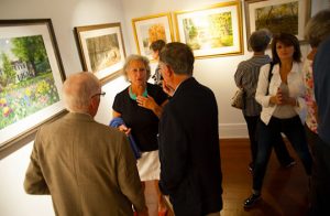 Visitors to the Chadds Ford Gallery chat and mingle during the opening night of "Scarborough Days - Another Visit To Scarborough Fair." 