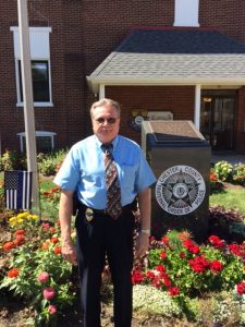 Chester County Det. Harold 'Butch' Dutter stands outside the Fraternal Order of Police Lodge No. 11 in West Chester, where a memorial commemorates the nine Chester County officers who died in the line of duty.