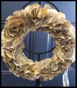 A wreath entitled "Fiddler on the Roof," made from sheet music, is one of Erica Pennick's creations to be sold at the Sanderson Museum.