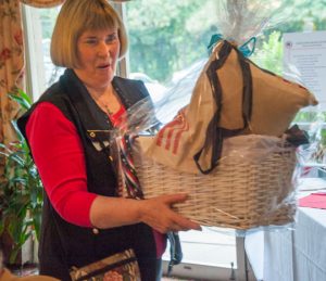 Former Chadds Ford resident Pat Wells with the "Basket of Deplorables" she won at at the luncheon.