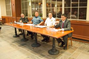 FBI Agent Charles Dayoub, far right, addresses the audience at the public safety forum in Kennett Square. With him are, from left, retired Judge Daniel Maisano. Lt. William Holdsworth, the acting police chief in Kennett Square, and Kennett Township Police Chief Lydell Not. 